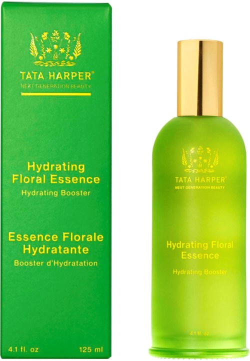 A green bottle with a gold cap and a matching box for Tata Harper's Hydrating Floral Essence, a skincare product.