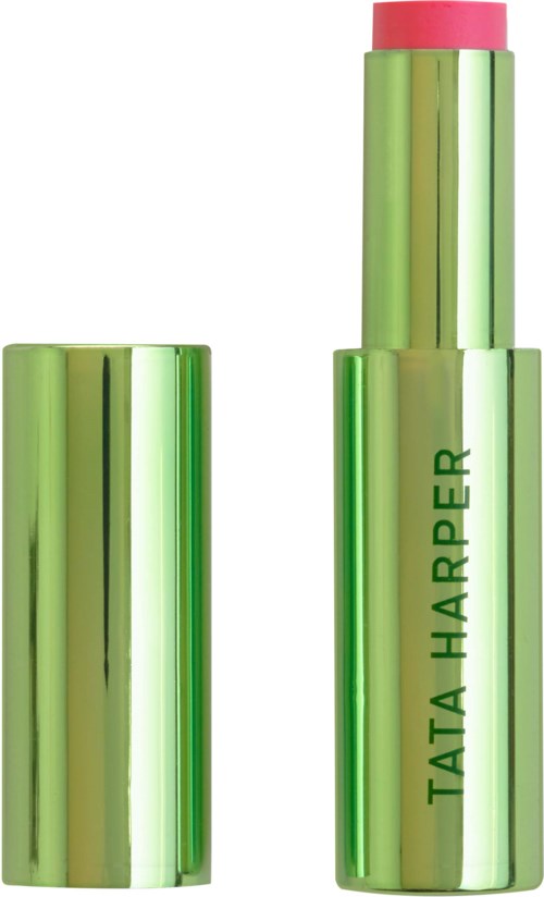 A green and pink lipstick with the brand name Tata Harper on it. The lipstick is partly extended from its tube.