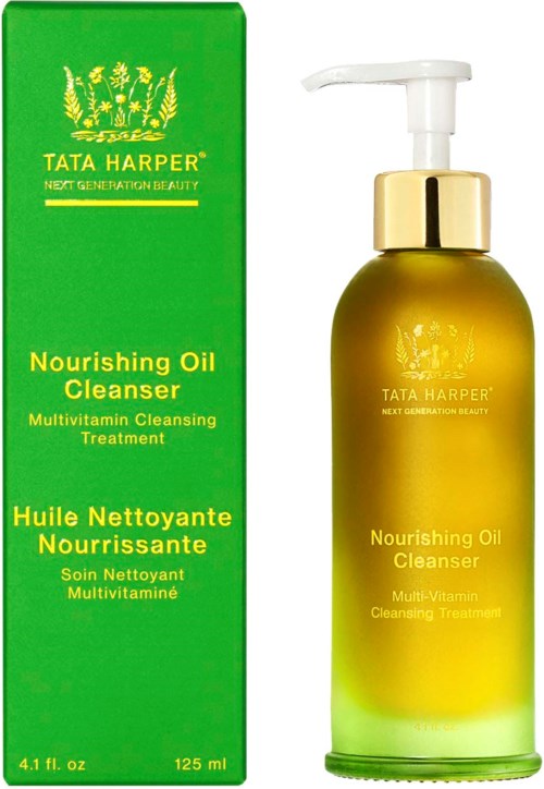 A green box and a yellow bottle with a pump, both labeled Tata Harper Nourishing Oil Cleanser.