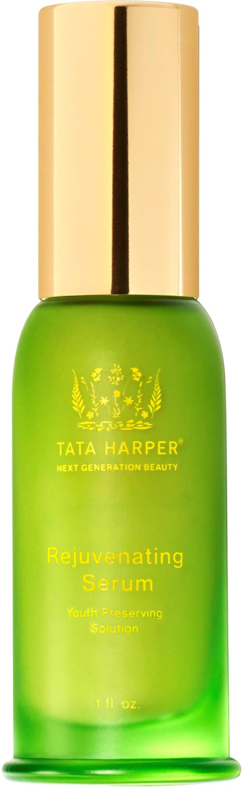 Green bottle with a gold cap. Label says Tata Harper Rejuvenating Serum, for skin brightness and smoothing.