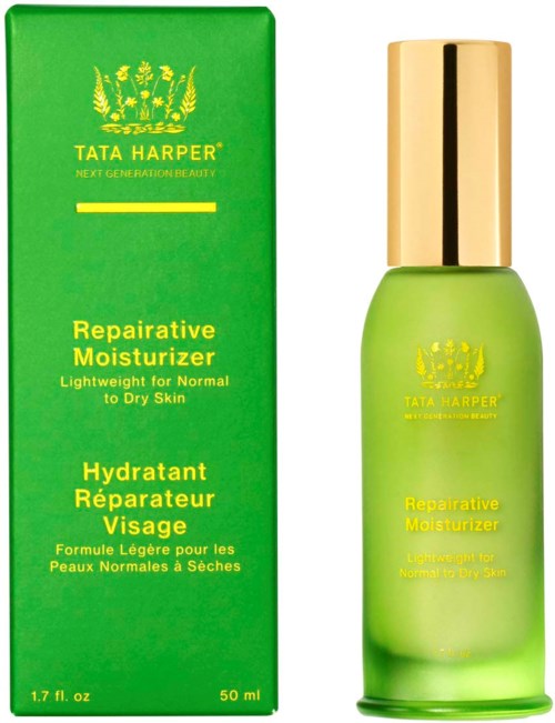 Green bottle with yellow text and logo, indicating it's a moisturizer for dry and normal skin.