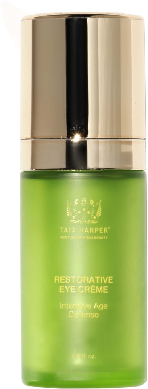 Green bottle of eye cream with a silver cap, labeled 'Restorative Eye Creme'.