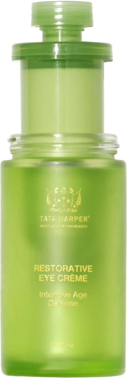 A green bottle of Tata Harper Restorative Eye Crème for aging skin. It has a pump top and a clear container.