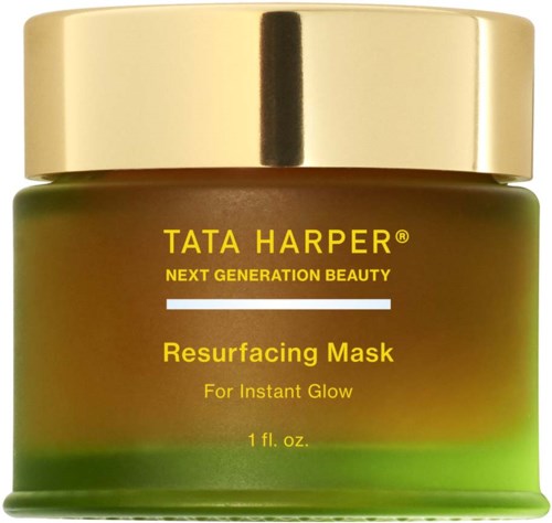 A jar of Tata Harper Resurfacing Mask with a gold lid and green container. Text describes it as for instant glow.