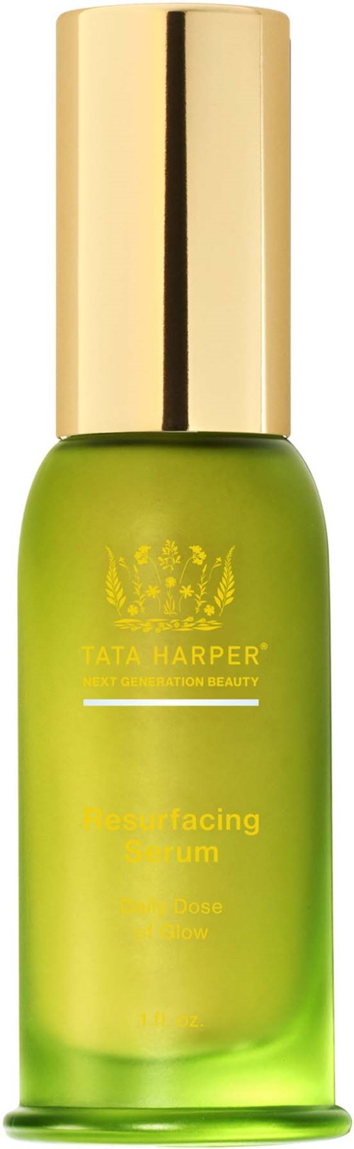 Green bottle with a gold cap, labeled Tata Harper Resurfacing Serum, containing skincare product.