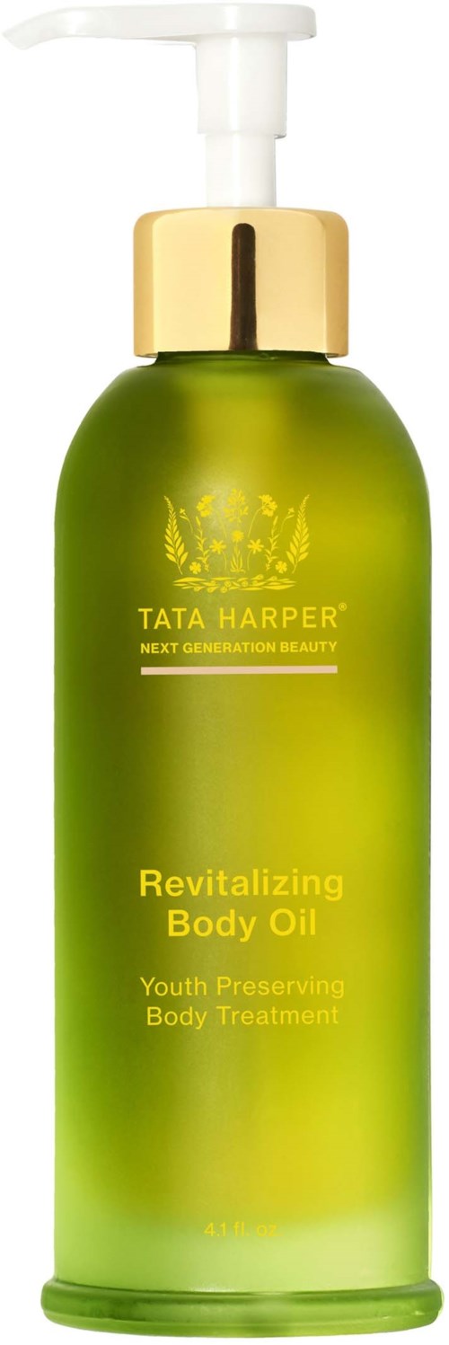 Green bottle with a pump, labeled Tata Harper Revitilizing Body Oil, for skin care and body treatment.
