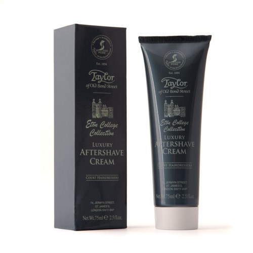 En svart låda och en tub av Taylor lyx aftershave creme med gulddetaljer för court frisörer.