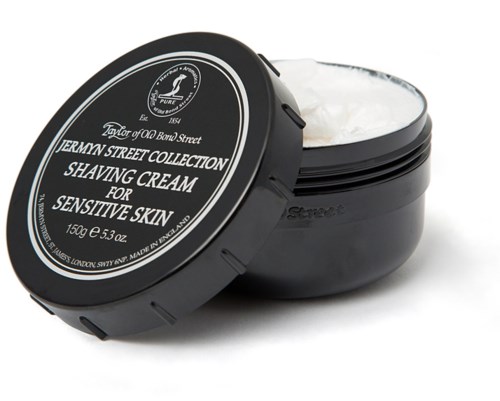 A black jar of shaving cream with a white lid, labeled for sensitive skin, from the Jermyn Street Collection.