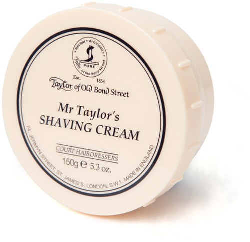 A round container of Mr Taylor's shaving cream with black and white label. It has text about the product and brand.
