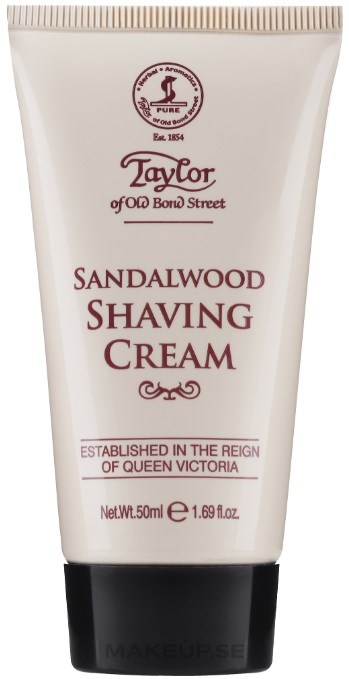 A white tube with a black cap, labeled as sandalwood shaving cream, contains 50ml and mentions Queen Victoria.