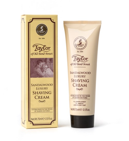 A tube of sandalwood luxury shaving cream next to its box, both from Taylor of Old Bond Street.