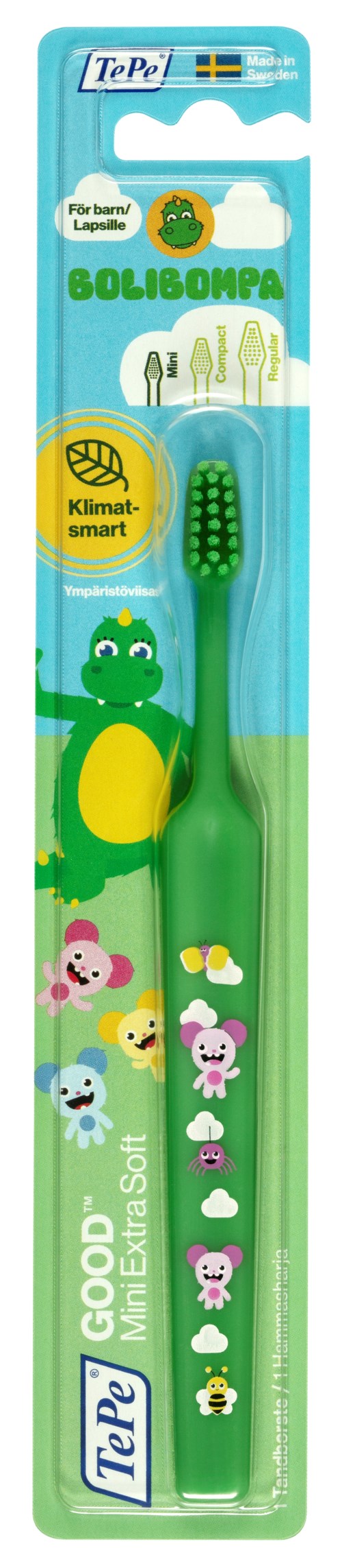 A children's toothbrush with a green handle, dinosaur design, on a blue and green package, promoting environmental care.