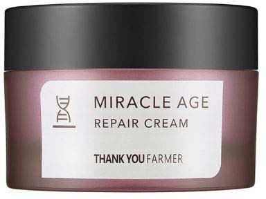 Pink jar with black lid, labeled 'Miracle Age Repair Cream' by Thank You Farmer, brand DHC.