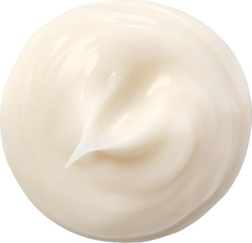 Creamy white substance with a swirl, smooth texture, round shape, and a pointed tip in the center.