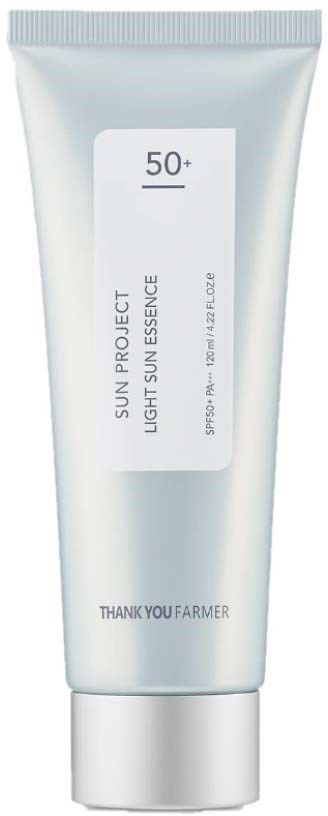 Sun protection tube labeled 'Light Sun Essence' with SPF 50+ and brand 'Thank You Farmer.'