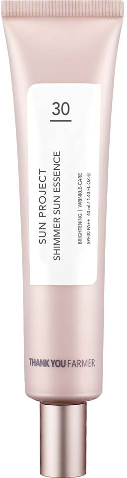 A tube of Sun Project Shimmer Sun essence with SPF 30. It has a minimalistic design with white and light pink colors.