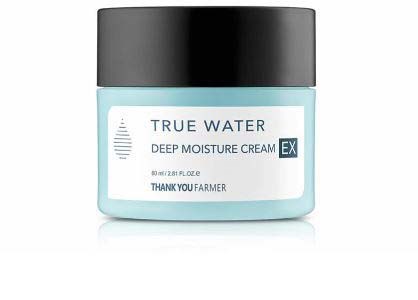 A light blue jar of deep moisture cream with a black lid, labeled "True Water" and "Thank You Farmer."