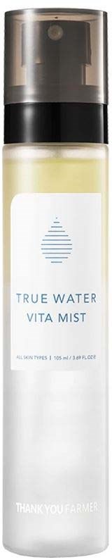 A tall white bottle with a black cap, labeled "True Water Vita Mist" and a water droplet symbol.