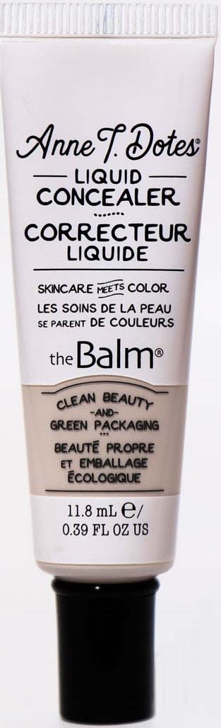 Ein weißer Tube mit The Balm flüssigem Concealer mit schwarzem Deckel und Produktname in Schwarz und Rosa.