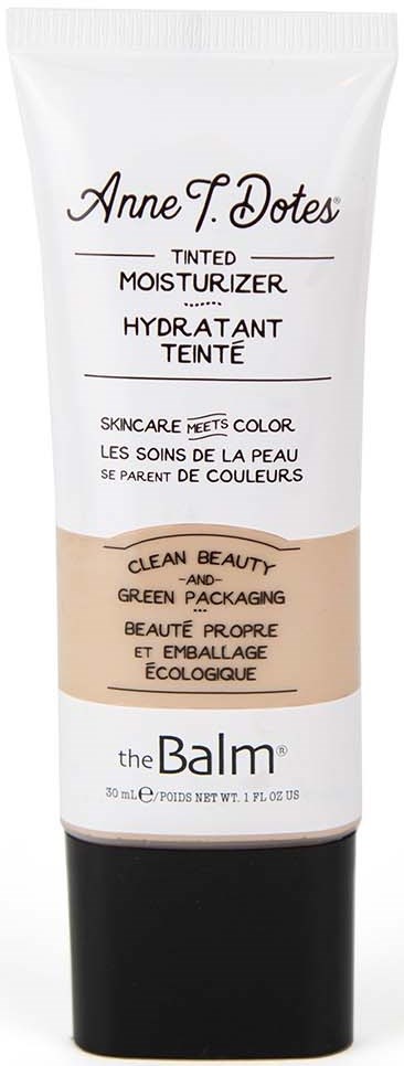 Een witte en zwarte tube getinte moisturizer van The Balm, met productgegevens en merk op de voorkant.