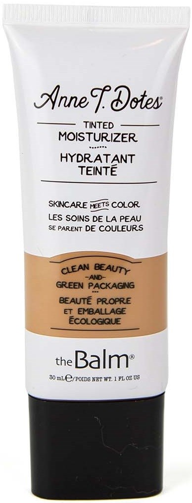 Een witte en zwarte tube getinte dagcrème door Anne F. Dotes van The Balm, met bruin gedeelte en productinformatie.