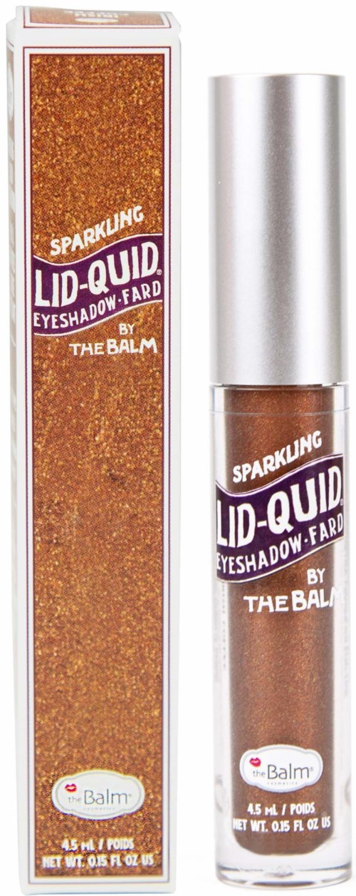 Een glinsterende oogschaduw tube en de bijbehorende box, beide in oranje en paarse tinten, gelabeld "Sparkling Lid-Quid" door The Balm.