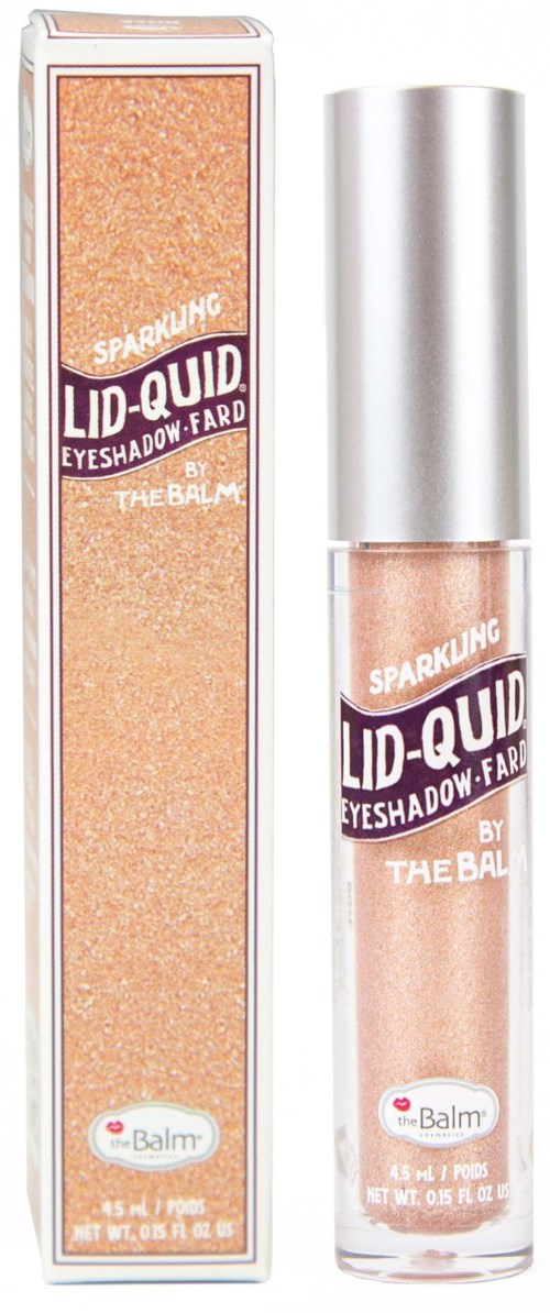 Een glanzende oogschaduw in een doorzichtige fles met zilveren deksel en doos. Label zegt "Lid-Quid" door The Balm.