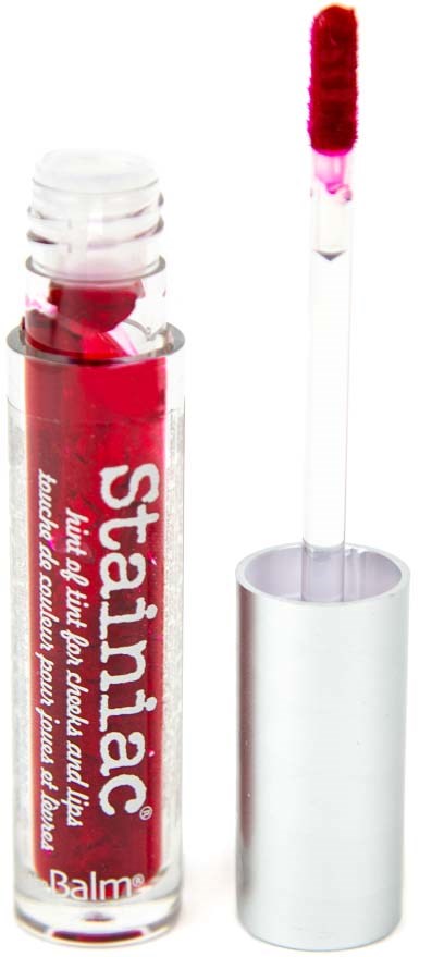 Lippenbalsemverpakking met witte dop, rode glans binnenin, en een applicator met rode substantie.