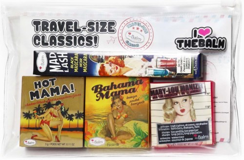Travel-sized classic cosmetic and skincare products in a transparent bag, including soap, masks, and small toiletries.