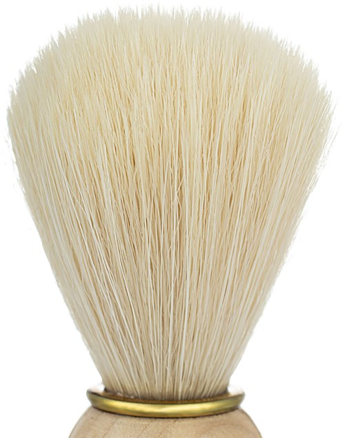 A shaving brush with cream-colored bristles and a wooden handle.