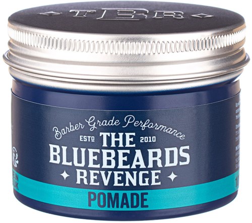 A blue container of pomade for hair with silver lid, labeled "The Bluebeards Revenge" and "Pomade."
