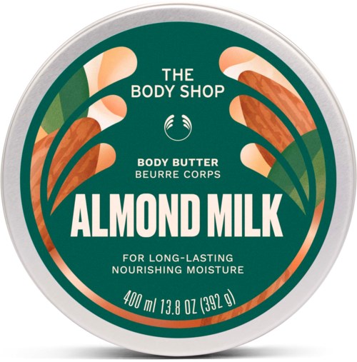 Rund boks med almond milk kroppssmør fra The Body Shop med grønt og oransje blomsterdesign på lokket.