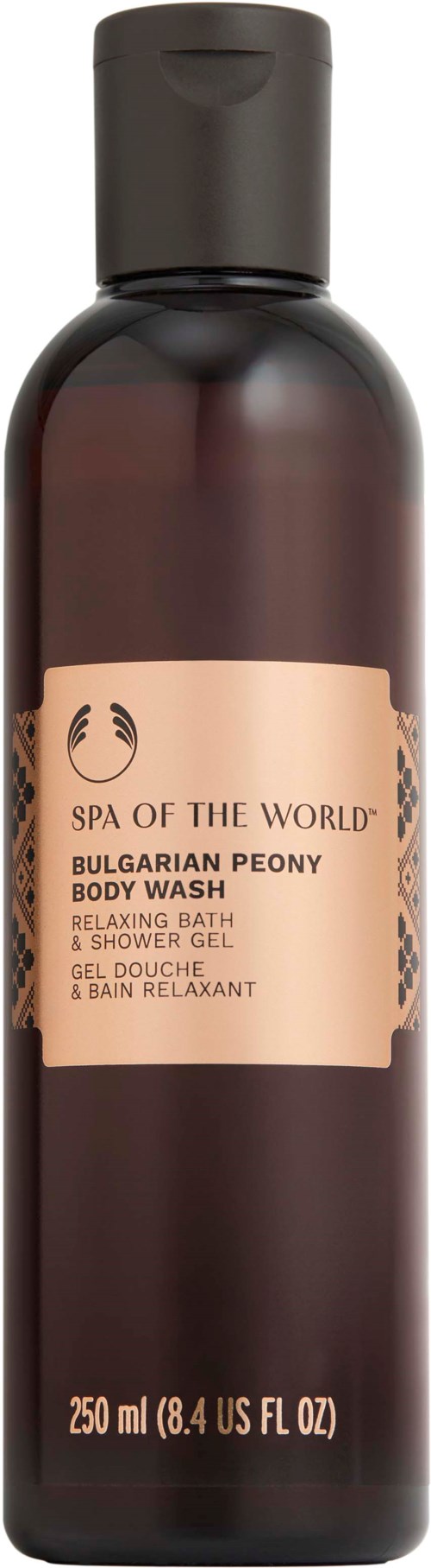 En lang, mørk brun flaske med en etikett som sier 'Spa of the World Bulgarian Peony Body Wash.'