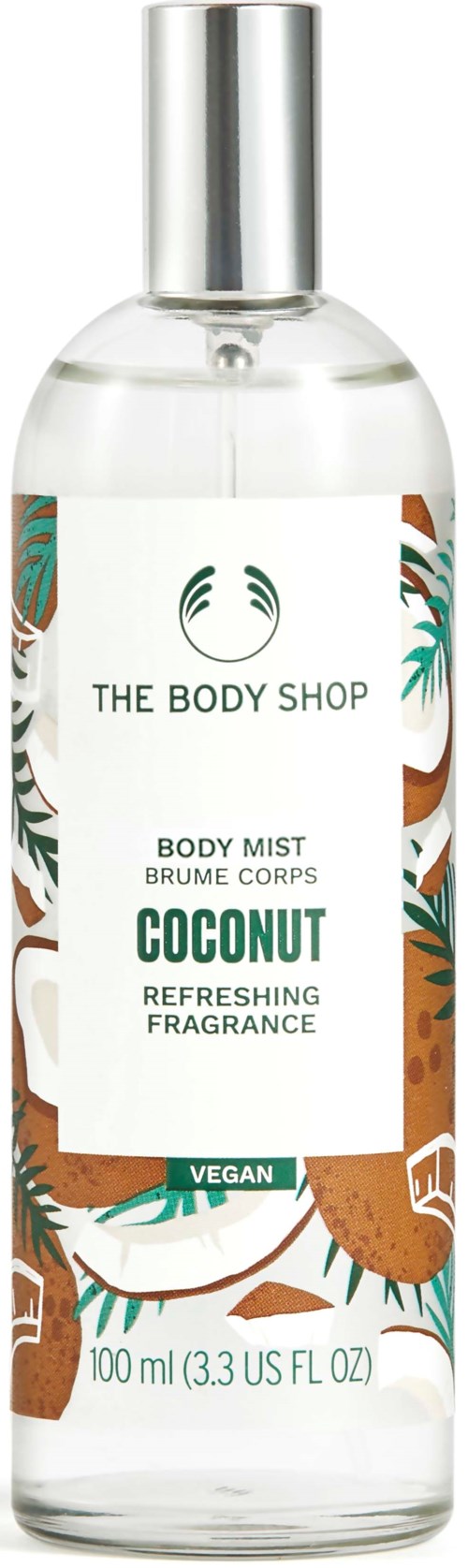 Eine klare Körpersprayflasche mit silberner Kappe, mit Kokosduft von The Body Shop, mit tropischen Blättern im Design.