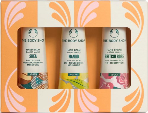 Three tubes of skincare products from The Body Shop with different scents: Shea, Mango, and British Rose.