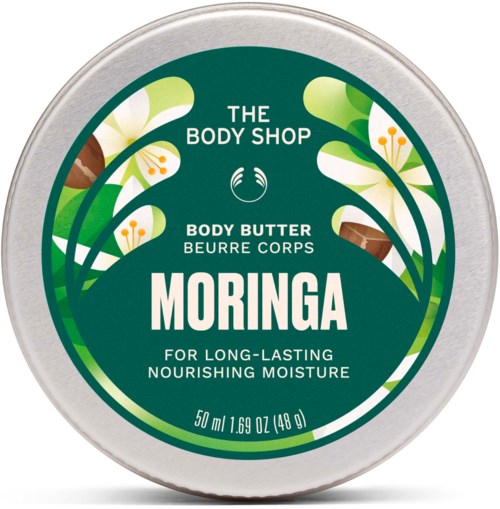 Rund behållare med grön etikett som visar vita blommor, text för kroppssmörjning, och storlek 50 ml från The Body Shop.