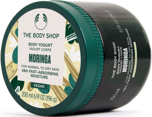 Ein schwarzer Behälter mit grünem Deckel enthält Körperjoghurt mit Moringa für trockene Haut.