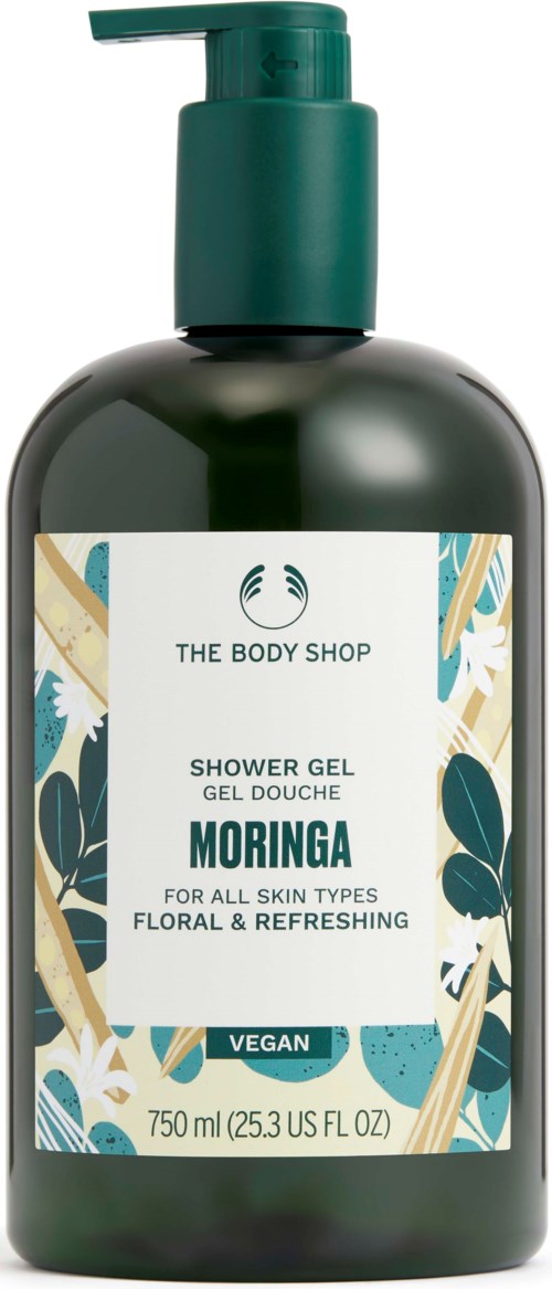 A bottle of Moringa shower gel from The Body Shop with a floral design on the label.