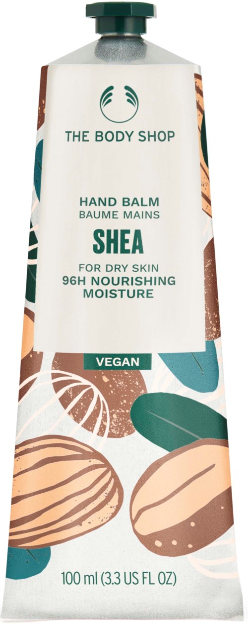 A tube of The Body Shop Shea hand balm, vegan, for dry skin, 100ml, with leaf and nut illustrations.