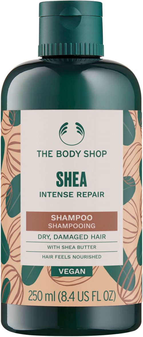 Eine grüne Flasche von The Body Shop Shea Intensive Repair Shampoo für trockenes, beschädigtes Haar mit Sheabutter, vegan.