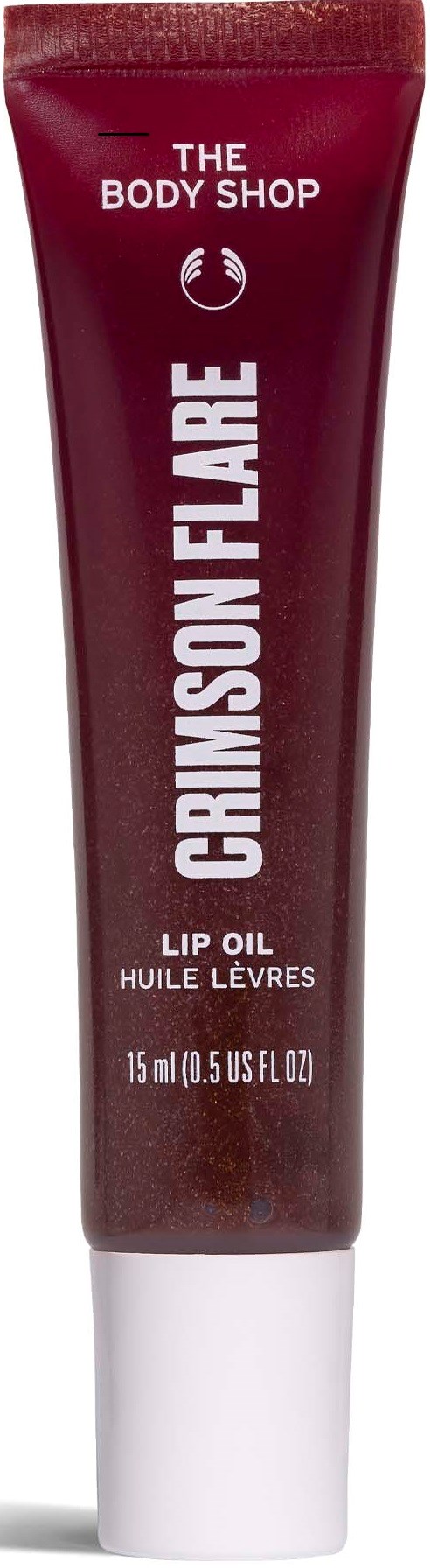 Röd tub med Crayon Flare läppolja från The Body Shop med vit text och vit topp.