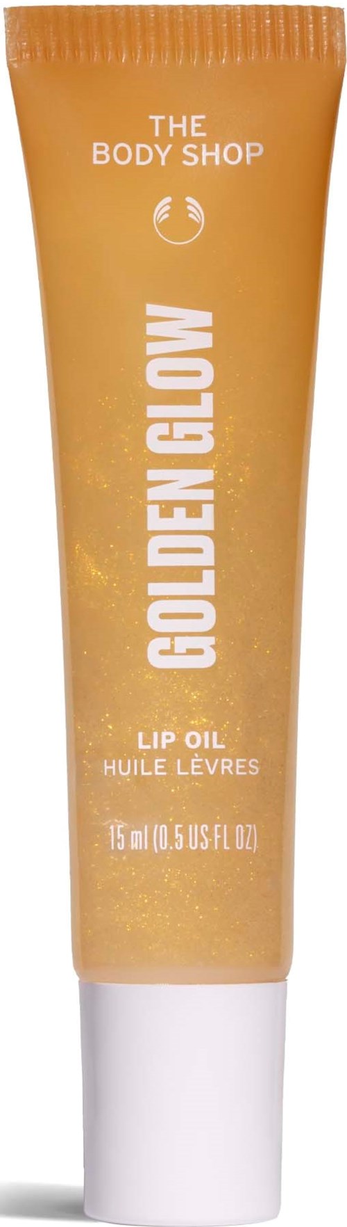 En liten flaska med läppolja från The Body Shop i gyllene färg med vit kork.