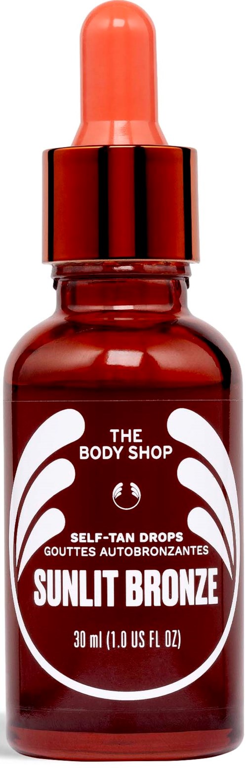 En liten röd flaska med droppkork, märkt Sunlit Bronze, från The Body Shop, för självbränning.