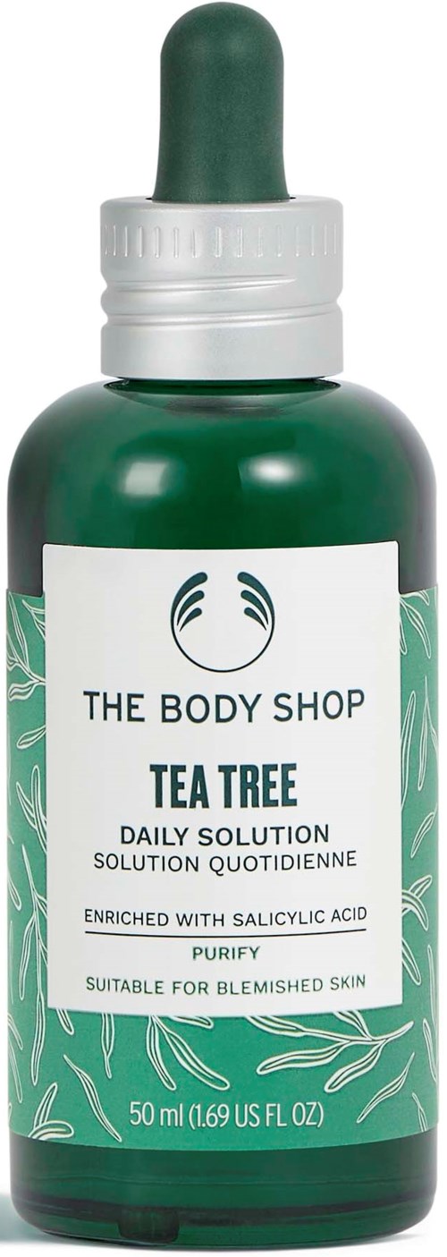 Vihreä pullo tipparipolla ja etiketti 'The Body Shop Tea Tree Daily Solution', teepuunäytteille ihovaurioille.