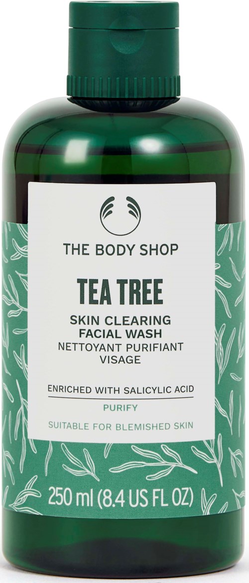 Vihreä pullo Tea Tree kasvojen puhdistusvaahtoa etikettitekstillä ja lehtikuvioilla, 250 ml. Sopii epäpuhdas iho.