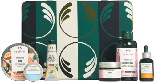 Eine Sammlung von Körperpflegeprodukten mit dunklegrünem, cremefarbenem und rosa Themenschachtel im Hintergrund.
