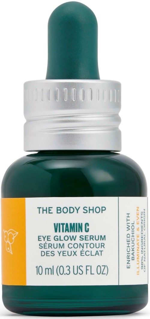 A small green bottle with a dropper cap, labeled Vitamin C eye serum from The Body Shop.