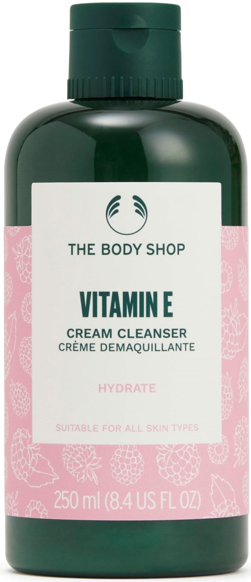 Vihreä The Body Shop Vitamin E -voidepuhdistaja, muodoltaan tavallinen pullo punaisella ja valkoisella etikettillä.