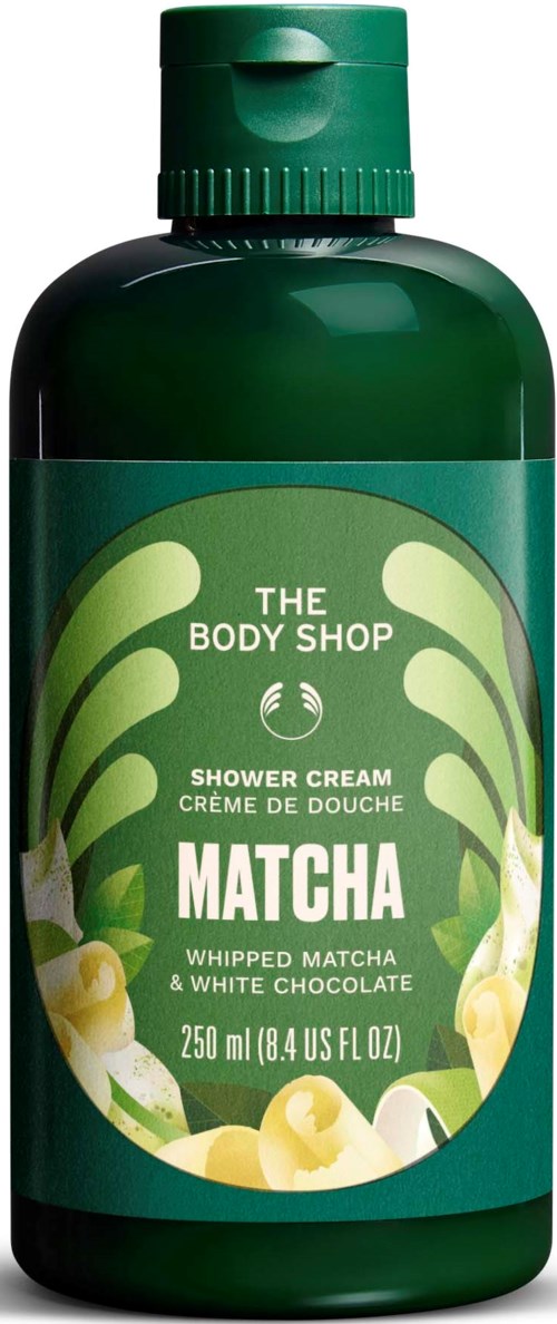 Vihreä pullo The Body Shop Matcha suihkakermasta, jossa valkoinen ja vihreä etiketti kasvi kuvalla ja tuotetiedoin.