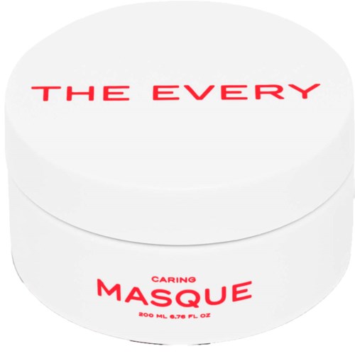 A white container with red text that says 'THE EVERY' and 'CARING MASQUE', indicating a skincare product.